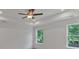 Large bedroom with natural light, ceiling fan, and views of surrounding greenery at 372 Waterbluff Dr, Mableton, GA 30126