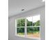 Bright picture window view of trees and sky at 372 Waterbluff Dr, Mableton, GA 30126