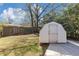 A view of the backyard with a storage shed at 3811 Turner Heights Dr, Decatur, GA 30032