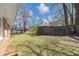 View of the yard with mature trees and wood privacy fence at 3811 Turner Heights Dr, Decatur, GA 30032