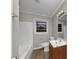 Bright bathroom with a wood vanity and a shower-tub combo at 3811 Turner Heights Dr, Decatur, GA 30032