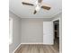 Bright bedroom featuring hardwood flooring, a ceiling fan, neutral paint, and ample natural light at 3811 Turner Heights Dr, Decatur, GA 30032