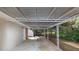 Attached carport with a metal roof supported by decorative metal posts at 3811 Turner Heights Dr, Decatur, GA 30032