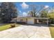 Single story home with an attached garage and carport over an extended driveway at 3811 Turner Heights Dr, Decatur, GA 30032