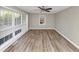 Bright living room with hardwood floors, a ceiling fan, and large windows at 3811 Turner Heights Dr, Decatur, GA 30032