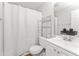 Bathroom featuring a shower-tub, toilet, and single sink vanity at 2485 Field Spring Dr, Stonecrest, GA 30058
