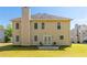 Exterior view of home with a small patio and lawn at 2485 Field Spring Dr, Stonecrest, GA 30058