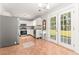 Spacious kitchen with stainless steel appliances, tile floors, and French doors leading to the backyard at 2485 Field Spring Dr, Stonecrest, GA 30058