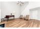 Bright living room with high ceilings, hardwood floors, and a piano at 2485 Field Spring Dr, Stonecrest, GA 30058