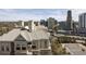 Enjoy aerial view of a building with a parking lot and skyline backdrop at 3338 Peachtree Ne Rd # 2804, Atlanta, GA 30326