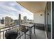 Balcony with seating and a grill, offering skyline views, perfect for outdoor entertaining at 3338 Peachtree Ne Rd # 2804, Atlanta, GA 30326
