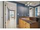 Bathroom featuring a granite countertop, wood vanity, and tiled floors leading to the bedroom at 3338 Peachtree Ne Rd # 2804, Atlanta, GA 30326