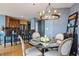 The stylish dining room features a chandelier and seating for six, perfect for hosting dinner parties at 3338 Peachtree Ne Rd # 2804, Atlanta, GA 30326