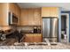 Modern kitchen with granite countertops, stainless steel appliances, and wooden cabinets at 3338 Peachtree Ne Rd # 2804, Atlanta, GA 30326