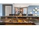 Contemporary kitchen features granite countertops and stainless steel sink, with seating at the breakfast bar at 3338 Peachtree Ne Rd # 2804, Atlanta, GA 30326
