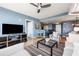 Well-lit living room with hardwood floors, comfortable seating, and an open view into the dining area at 3338 Peachtree Ne Rd # 2804, Atlanta, GA 30326