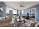 Bright living room features expansive city views, hardwood floors, and comfortable seating with stylish decor at 3338 Peachtree Ne Rd # 2804, Atlanta, GA 30326
