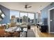 Bright living room features expansive city views, hardwood floors, and comfortable seating with stylish decor at 3338 Peachtree Ne Rd # 2804, Atlanta, GA 30326