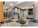 Spacious lobby with sleek tile flooring, modern lighting, and concierge desk for a welcoming atmosphere at 3338 Peachtree Ne Rd # 2804, Atlanta, GA 30326