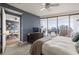 Spacious main bedroom leads to the living room with balcony access and city views at 3338 Peachtree Ne Rd # 2804, Atlanta, GA 30326