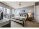 Comfortable main bedroom features a ceiling fan, balcony access, and plenty of natural light at 3338 Peachtree Ne Rd # 2804, Atlanta, GA 30326