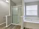 Bathroom featuring a tub, separate shower, tile floors and a large window at 344 Springbottom Ct, Lawrenceville, GA 30046