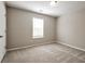 Neutral bedroom with carpet, window, and door at 344 Springbottom Ct, Lawrenceville, GA 30046