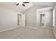 Spacious bedroom with vaulted ceilings, neutral colors, carpet floors and ceiling fan at 344 Springbottom Ct, Lawrenceville, GA 30046