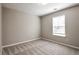 The bedroom has neutral walls, carpeted floor, and a window at 344 Springbottom Ct, Lawrenceville, GA 30046