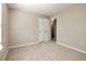 The room has neutral walls, carpeted floor, a window, and a closet at 344 Springbottom Ct, Lawrenceville, GA 30046