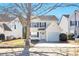 Charming two-story home with white siding, black shutters, and a well-maintained front yard at 344 Springbottom Ct, Lawrenceville, GA 30046