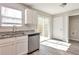 Kitchen featuring stainless steel appliances, granite countertops and a door leading to the deck at 344 Springbottom Ct, Lawrenceville, GA 30046