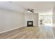 Bright living room with a cozy fireplace and open layout, featuring light wood flooring at 344 Springbottom Ct, Lawrenceville, GA 30046