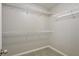 Walk-in closet with carpet flooring and adjustable metal shelving at 344 Springbottom Ct, Lawrenceville, GA 30046