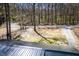 Aerial view of the home's metal roof and surrounding wooded landscape at 116 Carroll St, Temple, GA 30179