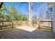 A spacious wooden back deck with railings, perfect for outdoor entertaining and relaxation at 116 Carroll St, Temple, GA 30179