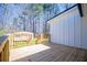 A view of the wood deck leading towards white siding and a storage shed at 116 Carroll St, Temple, GA 30179