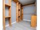 Spacious walk-in closet with custom wood shelving and vinyl flooring at 116 Carroll St, Temple, GA 30179