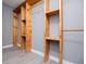 Spacious walk-in closet with custom wood shelving and vinyl flooring at 116 Carroll St, Temple, GA 30179