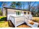 Charming home with white siding, shutters, and a lovely, inviting front porch at 116 Carroll St, Temple, GA 30179