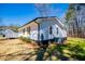 Exterior of the home with siding, greenery, and an air conditioning unit at 116 Carroll St, Temple, GA 30179