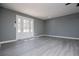 Spacious living room with stylish gray walls and beautiful flooring at 116 Carroll St, Temple, GA 30179