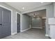 Living room with gray walls and trim, and two dark gray doors that contrast with the white trim at 116 Carroll St, Temple, GA 30179