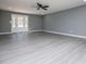 Bright and airy living room with neutral gray walls and light flooring at 116 Carroll St, Temple, GA 30179