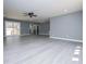 Spacious open concept living room with light flooring and abundant natural light at 116 Carroll St, Temple, GA 30179