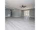 Bright and airy living room with neutral gray walls and light flooring at 116 Carroll St, Temple, GA 30179