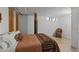 A spacious bedroom featuring a comfortable bed, exposed wooden beams, and white walls at 170 Boulevard Se # 104E, Atlanta, GA 30312