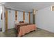 A bright bedroom featuring a cozy bed, exposed wooden beams, and white walls at 170 Boulevard Se # 104E, Atlanta, GA 30312