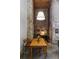 A bright dining room featuring a wooden table, exposed brick wall, and high ceilings at 170 Boulevard Se # 104E, Atlanta, GA 30312