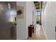 Hallway view leading into the condo with a shoe shelf, art on the wall and door entrance at 170 Boulevard Se # 104E, Atlanta, GA 30312
